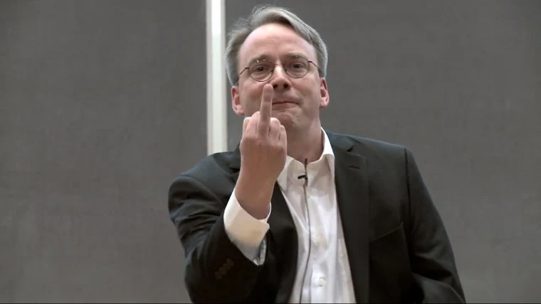Linus Torvalds making an irritated gesture during a talk